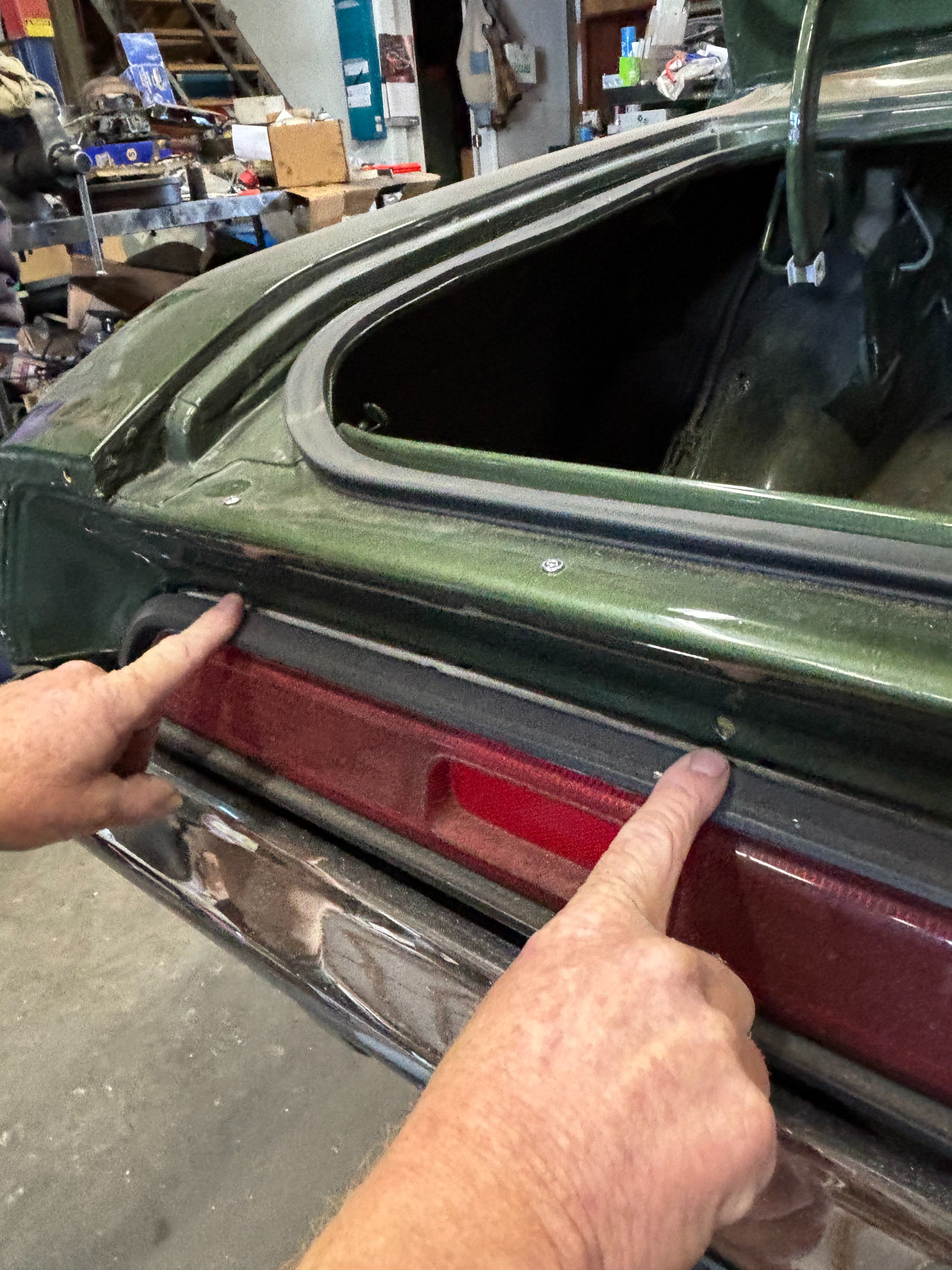 70 CHALLENGER SE - HOLES WHERE 6 CLIPS GO FOR VALENCE ABOVE TAIL LIGHTS.jpeg