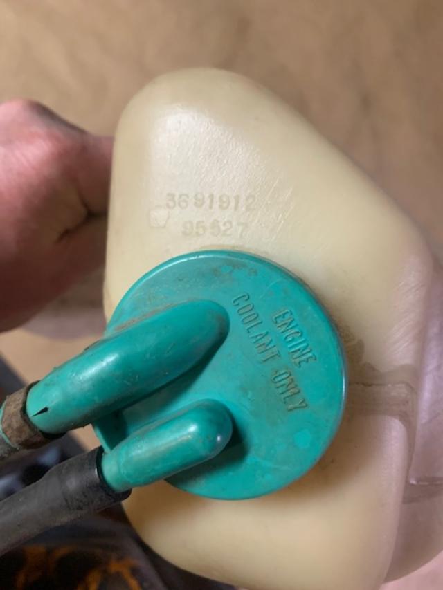 74 e body overflow bottle....jpg