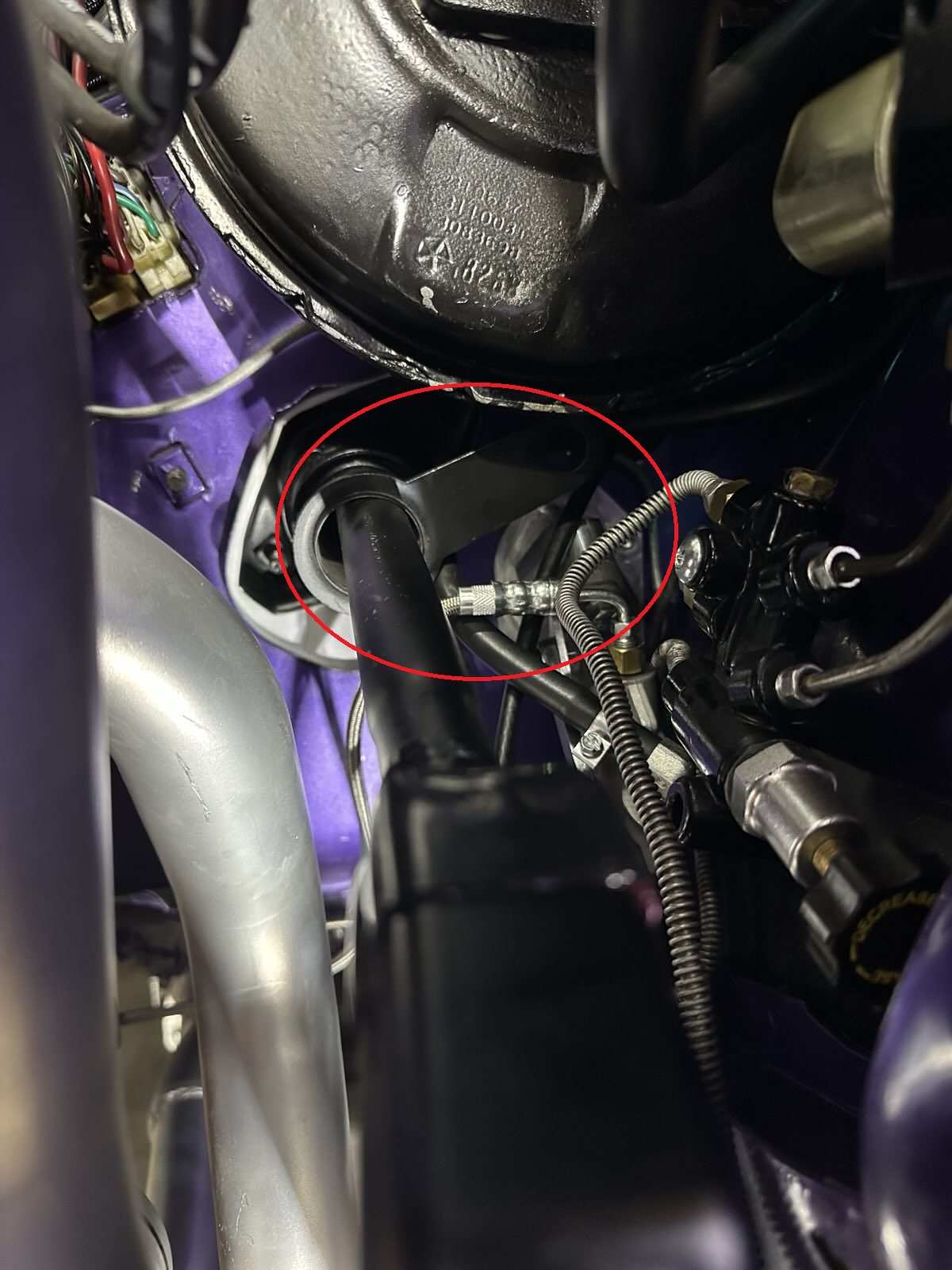 Steering Column Reverse Lockout Arm Hitting (circled).jpg